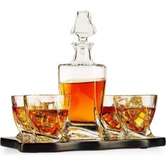 four glasses and a decanter on a tray