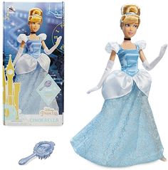 the doll is wearing a blue dress and tiara