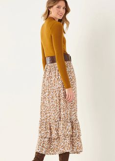 Add some country charm to your fall wardrobe with an easy fit and flowy maxi skirt. Long petticoat tiers style up this darling fall floral with comfy elastic waist silhouette. 100% Viscose Fall Tiered Ruffled Skirt, Casual Brown Maxi Skirt For Fall, Brown Tiered Skirt Bottoms For Fall, Brown Tiered Skirt For Fall, Modest Fall Skirt With Elastic Waistband, Fall Ruffled Maxi Skirt, Fall Maxi Length Bottoms With Elastic Waistband, Fall Floral Print Flowy Maxi Skirt, Floral Print Skirted Bottoms For Fall