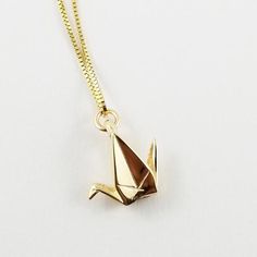 ***MADE TO ORDER, WILL SHIP 1-2 WEEKS FROM ORDER DATE***The crane has long been a symbol of hopes and wishes in Eastern culture and it is said that one who folds 1000 cranes with an intention will be granted their hearts desire. This elegant, solid 10k gold gold origami paper crane charm allows you to carry your hopes and wishes with you everywhere you go. The origami hope crane necklace makes a great gift for that special friend who needs a little extra good luck and vibrations in their lives. Crane Necklace, 1000 Cranes, Origami Necklace, Eastern Culture, Origami Jewelry, Geek Crafts, Turtle Gifts, Paper Gifts Anniversary, First Anniversary Gifts