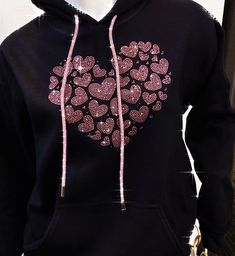 "Really special multi pink rhinestones heart design on black hoodie. Small hearts of different sizes come together to make one big heart. We make this design using pretty pink rhinestones. We use high quality rhinestones for all our designs. They are super sparkly and pictures do not do them justice! This hoodie also has a really nice rhinestone pink drawstring.  Makes a great birthday, wedding or Mother's day gift. Hoodie is made of 50cotton/50poly fleece. Super soft and comfy. Nice medium weig Black Hooded Sweatshirt Gift, Black Hooded Sweatshirt As Gift, Winter Hoodie With Rhinestones, Black Rhinestone Hoodie For Winter, Black Cotton Hoodie For Gift, Black Cotton Hoodie As Gift, Black Casual Hoodie As Gift, Casual Black Hoodie As Gift, Black Cotton Sweatshirt With Heart Graphic