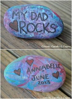 two rocks with the words, my dad rocks and an image of hearts painted on them