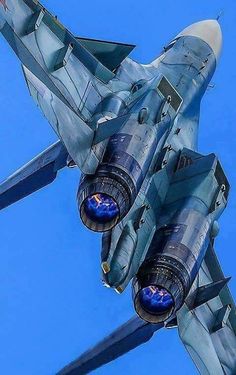 a fighter jet is flying through the blue sky