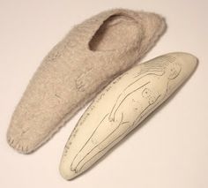 a pair of slippers sitting on top of a white table