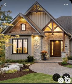 a house that is lit up with lights on the front door and windows in the back