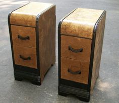 two wooden drawers sitting next to each other