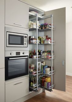 an open pantry in the corner of a kitchen