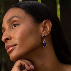 The Story A chic and colorful pair of vintage earrings made from 14 karat yellow gold. Each earring has two lapis lazuli cabochons. The deep blue hue is rich, and each piece has a different pattern of pyrite flecks, making them have a personality of their own.The bottom pieces are independently attached, giving them movement and swing with the wearer. They finish with a post back, and at 1.61 inches in length, they have a chic and eye-catching look. The Specs Style Number: R4029 Vintage, circa 2 Blue Lapis Lazuli Earrings For Formal Occasions, Elegant Lapis Lazuli Jewelry With Matching Earrings, Formal Blue Lapis Lazuli Earrings, Vintage Lapis Lazuli Jewelry, Gold Lapis Lazuli Earrings, Luxury Blue Gold-plated Earrings, Elegant Gold Lapis Lazuli Earrings, Elegant Lapis Lazuli Earrings, Gold Teardrop Lapis Lazuli Earrings