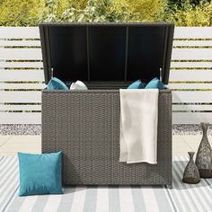 Protect your outdoor cushions from the elements and add some extra seating with this cushion storage box. With weather-resistant resin wicker and waterproof lining, this storage bench ensures your cushions stay dry and free from sun damage. Octans 46.4-in x 28.7-in Gray Outdoor Storage Shed | SL2C00098 Small Outdoor Storage, Outdoor Storage Shed, Cushion Storage, Patio Storage, Deck Box, Outdoor Storage Sheds, Cover Style, Pool Toys, Fire Table