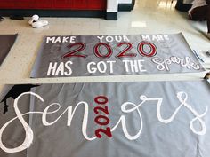 two signs that say seniors make your mark and 2020 has got the spirit