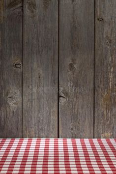 a red and white checkered table cloth on a wooden background royalty images, stock photos