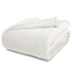 a white blanket folded on top of each other