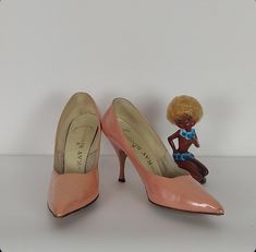 Shiny pearly melon pink leather vintage ladies pumps. King Kay Unbreakable brand, patent leather, 1980's era, leather soles, plastic heel tips. 3" heel, 3" toe box, 10" long.  **Please- We highly encourage all questions about the items listed.** If the size, color, condition of the item is unclear or you have questions regarding shipping please message us before completing your order. If you need assistance understanding your measurements please contact us and we will do our best to guide you so that you and your item are a perfect fit!  We are two women of Portland, Oregon, who love clothing and the power of adornment. Clothing is as old as culture itself and is cross-species. We believe that adornment is a physical expression of self so we put this shop together to help connect you to yo Ladies Pumps, Plastic Heels, Love Clothing, Patent Leather Heels, Pink Leather, Portland Oregon, Womens Heels, Pump Shoes, Melon