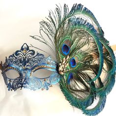 This filigree laser cut mask painted in Navy Blue and embellished with Rhinestones and adorned with Peacock feathers. If you pick the custom stone option, leave a note during check out with the colors you would like and a contact number to send pics for approval. Thank you for supporting small businesses and hope our products bring you and loved ones some joy and humor in these trying times. S H I P P I N G - Current processing times range 5-7 days. Pls note expedited & 1-2 day guaranteed de Blue Eye Mask For Mardi Gras, Masquerade Mask Women, Elegant Face Mask, Venetian Masquerade Masks, Feather Mask, Mask Painting, Venetian Masquerade, Carnival Festival, Blue Peacock