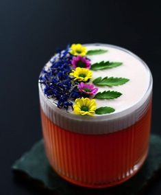 a cake with flowers and leaves on it