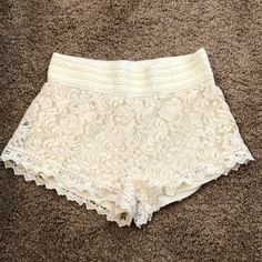 Ambiance Apparel White Lace Shorts. Never Worn But No Tags. There’s A Liner On The Inside So It’s Not See Through. Thick Waist Band. Excellent Condition. No Rips, Tears, Or Stains. 12 Inches Long. 13.5 Inches From Hip To Hip. 1 Inch Inseam. 65% Cotton. 35% Nylon. Feminine Cream Bottoms For The Beach, Feminine Cream Bottoms For Beach, Feminine Cream Beach Bottoms, High Waist Lace Shorts For Summer, Lace Bottoms For Beach, Short Length, Summer High Waist Lace Shorts, Beach Shorts With Lace Trim In Cotton, Beach Shorts With Lace Trim, White Lace Trim Summer Shorts