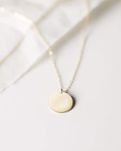 Material: Sterling Silver; Finish: Hammered Minimalist 14k Gold Pendant Necklace, Everyday Hammered Medallion Jewelry, Modern 14k Gold Round Pendant Necklace, Simple Round Pendant Charm Necklace For Everyday, Minimalist 14k Gold Filled Round Necklace, Simple Yellow Gold Necklaces With Round Pendant, Classic Jewelry With Round Pendant For Everyday, Classic Everyday Jewelry With Round Pendant, Simple Yellow Gold Round Pendant Necklaces