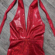 Made of our holographic red shattered glass spandex, this halter romper hugs the body, but offers plenty of stretch. The halter top ties at the back of the neck. Our seamless front design is extremely comfortable and prevents camel toe. Wear this to a rave, to a festival, or an aerial performance. this is perfect for your Olivia Rodrigo outfit. Party Backless Halter Top With Back Opening, Fitted Red T-back Halter Top, Sleeveless Halter Top With Back Opening For Party, Fitted Halter Top With Back Opening For Party, Red Fitted Halter Top For Night Out, Red Sleeveless Halter Top For Party, Fitted Red Halter Top For Night Out, Red Sleeveless Halter Top For Evening, Party Stretch Halter Top With T-back