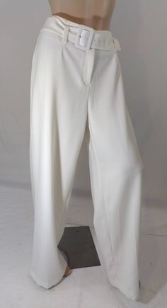 "Women's Pants Excellent Condition by ALFANI Size 14 Women's white/Off White pants, front zipper, stretchy quality fabric, matching belt. Well constructed, high quality. REALLY NICE PANTS!  Excellent condition. Easy to wear casual chic vintage for the disco sporting life. MEASUREMENTS: Length - 44\" Inseam - 32\" Waist - 36\"  Hips - 46\" MODEL STATS: Ht. - 5' 8.5\" Bust - 34\" Waist - 25\" Hips - 35\" *Please check measurements to ensure proper fit and remember to allow extra room for movement. White Full-length Bottoms With Belt Loops, White Full Length Pants With Belt Loops, Formal White Wide Leg Pants With Belt Loops, White Straight Pants With Belt Loops, Formal White Full Length Bottoms, White Wide-leg Pants With Belt Loops, Formal White Bottoms With Belt Loops, White Workwear Bottoms With Belt Loops, High-waist White Pants With Belt Loops