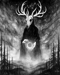 a deer with horns standing in the middle of a forest