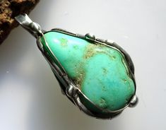 A powerful pendant - it is surrounded by an almost magical, archaic and shamanic aura. - wearable from both sides! - Trust and security! Pendant approx. 40 mm Chrysoprase approx. 29 x 18 x 12 mm Total weight approx. 9.0 g **Used material** chrysoprase Silver wire 935/000 Jewelery pewter containing silver Noble handwork - with heart and soul! The basis is silver wire 935/000 in various strengths, which is "woven" around the stone and then soldered and refined with solder containing silver. Spiritual Turquoise Necklace With Large Stone, Almost Magical, Soldered Jewelry, Soldering Jewelry, Heart And Soul, Heart Soul, Soldering, Silver Wire, Jewelry Necklace Pendant