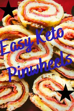 easy keto pinwheels with bacon and cheese on top, sitting on a red surface