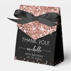 a black and pink glitter gift bag with a bow on the front that says thank you michle 30th birthday