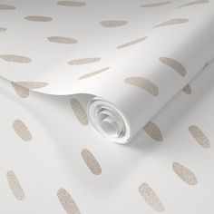 a white wallpaper with gold circles on it