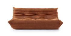 a brown couch sitting on top of a white floor