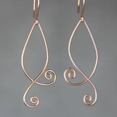 "The double serpentine spiral earrings are handmade using sterling silver wire. Free US shipping. In art, serpentine line is called\"The Line of Beauty\". S curves modulate from one gradient to another. S curves signify liveliness and activity and excite the attention of the viewer. This design is inspired by Rococo style, which is elegant, playful and uses lots of serpentine and spiral lines. Despite it popularity among the world, the Rococo is quintessentially the French Style. Customers who p Elegant Teardrop Copper Wire Earrings, Elegant Handmade Swirl Earrings, Elegant Nickel-free Copper Wire Earrings, Elegant Copper Wire Drop Earrings, Elegant Wire Dangle Wrap Earrings, Elegant Wire Wrap Dangle Earrings, Elegant Swirl Wire Wrapped Earrings, Elegant Dangle Wrap Earrings, Elegant Hand Forged Swirl Earrings