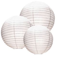 three white paper lanterns sitting next to each other