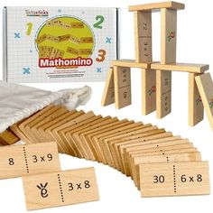 a set of wooden blocks with numbers on them next to a bag and two sets of clothes