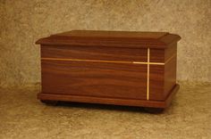 a wooden box with a cross on it