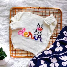 We are so excited to introduce the most interesting and comfortable customized embroidered sweaters for your little ones! A great baby shower, birthday gift, perfect option for family photos! Spring White Sweater With Embroidered Logo, Playful White Cotton Sweater, Cute Winter Sweater With Letter Embroidery, Cute White Sweater With Embroidered Text, White Cute Sweater With Embroidered Text, Cute Crew Neck Birthday Sweater, Cute Crew Neck Sweater For Birthday, Cute Crew Neck Sweater With Custom Embroidery, Cute Pink Sweater With Custom Embroidery