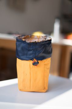 a yellow and blue bag sitting on top of a table