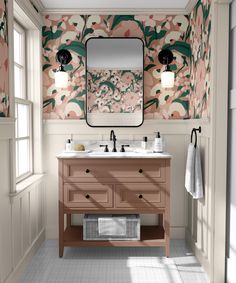 a bathroom with floral wallpaper and two sinks under a large mirror above the sink