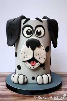 a cake shaped like a dog sitting on top of a table