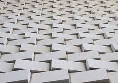 a close up view of some white bricks that have been made into an abstract pattern