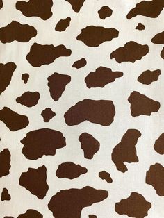 a brown and white cow print fabric