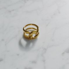 "A perfect statement ring, handcrafted with a chain styled band. This ring is well-made, eye-catching and pretty in gold color. Wear it to make your look fabulous. - Materials: 18K gold plated titanium - Measurements: approximately 0.6\" / 15mm in band width - Sizes: US6 - US9 - The product is tarnish-resistant and hypoallergenic Q&A 1. What is the material? - It is made from 18K real gold plated titanium. Titanium is nickel-free, zinc-free and hypoallergenic.. 2. Does the color tarnish? - T Durable Metal Chain Ring, Trendy Chain Rings In Metal, Trendy Metal Chain Rings, Trendy Adjustable Chain Open Ring, Trendy Adjustable Open Chain Ring, Trendy Chain Link Chain Ring As Gift, Gold Link Jewelry With Ring Detail, Gold Plated Chain Promise Ring, Minimalist Chain Link Metal Rings