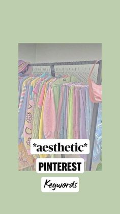 a rack filled with lots of different colored shirts next to a wall mounted sign that says aesthetic pinterest keywords