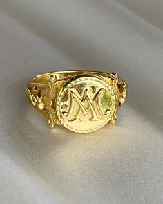 The Marie Antoinette Ring her monogrammed rIng MA, she was the queen of France brfore the French Revolution.  This beautiful ring made of 18k gold plated silver and inscribed inside Eat Cake. All items come in a gift box ready to gift. To see more please visit my Etsy shop at https://www.etsy.com/shop/BijouLimon Bijou Limon jewelry collections present a romantic French spin on the latest jewelry trends. Based on the US West Coast but French at heart, Bijou Limon interprets the current jewelry tr Marie Antoinette Jewelry, Vintage French Wedding, Rococo Jewelry, Wax Seal Ring, French Queen, Queen Of France, Jewelry Wax, Latest Jewellery Trends, Seal Ring