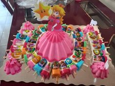 a cake made to look like mario and princess peach