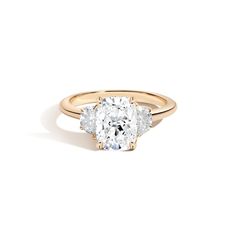 a three stone diamond ring in yellow gold