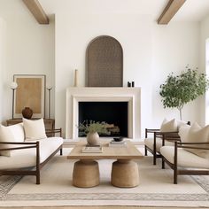 a living room filled with furniture and a fire place