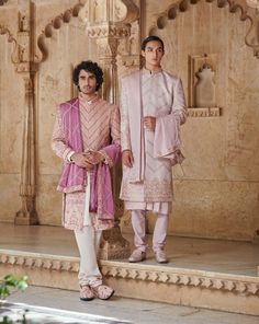 Pale pink Sherwani with long kurta, belt, and matching dupattaFrom Jigar & Nikita's Rang Mahal collection DELIVERY TIMEPlease allow 8-12 weeks for your outfit to arrive. FABRIC DETAILSTextured fabric, linen satin Professional cleaning only. Elegant Pink Sherwani For Festive Occasions, Elegant Pink Sherwani For Festive Season, Elegant Pink Festive Sherwani, Pink Unstitched Suit With Naqshi For Wedding, Traditional Pink Bandhgala For Transitional Season, Designer Pink Sherwani With Pallu, Elegant Pink Sherwani With Dabka Detailing, Pink Sherwani For Wedding And Festive Occasions, Pink Naqshi Unstitched Suit For Wedding