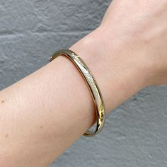 An adult-size plain polished 14K yellow gold-filled bangle bracelet. The outer shell is solid gold pressure-bonded to an inner core of high-quality brass. Guard and hinge Width: 6 mm Circumference: 7" Inner Core, Gold Filled, Bangle Bracelets, Solid Gold, Shells, Bangles, Yellow Gold, Brass, Gold