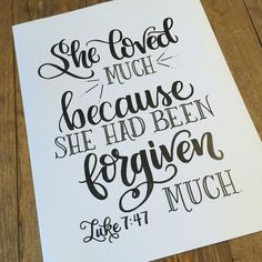 a hand lettered poster with the words she loved much because she had been forgotten