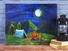 a painting of a campfire with a tent in the background on a wooden table