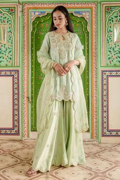 Powder green kurta with all over marori floral embroidery and gota embellishments. Comes with sharara and dupatta.
Components: 3
Pattern: Embroidered
Type Of Work: Thread, Gota, Marori
Neckline: Keyhole
Sleeve Type: Three quarter
Fabric: Pant and Kurta: Pure Spun Silk, Dupatta: Pure Organza
Color: Green
Other Details: 
Attached lining
Approx. Product Weight: 2 kg
Model Height: 5 ft 7 inches, wearing size S
Occasion: Sangeet,Mehendi and Haldi - Aza Fashions Pista Green Georgette Palazzo Set With Dabka, Elegant Pista Green Palazzo Set With Dabka, Eid Chinon Sets For Reception, Chinon Sets For Reception And Eid, Pista Green Palazzo Set With Dori Work, Dabka Palazzo Set For Reception, Chinon Straight Kurta Set For Reception, Chinon Sets For Eid Reception, Designer Chinon Sets With Gota Work